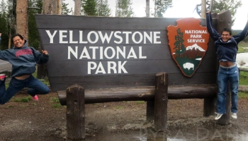 Jump shot in front of Yellowstone sign