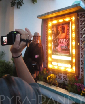 Villarosa stands in front of her movie's poster